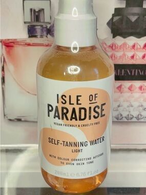 Isle of Paradise Self-Tanning Water - Light, Peach & Clear Bottle